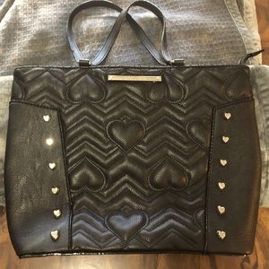 Betsy Johnson purse, black with silver hearts. Has been slightly used.